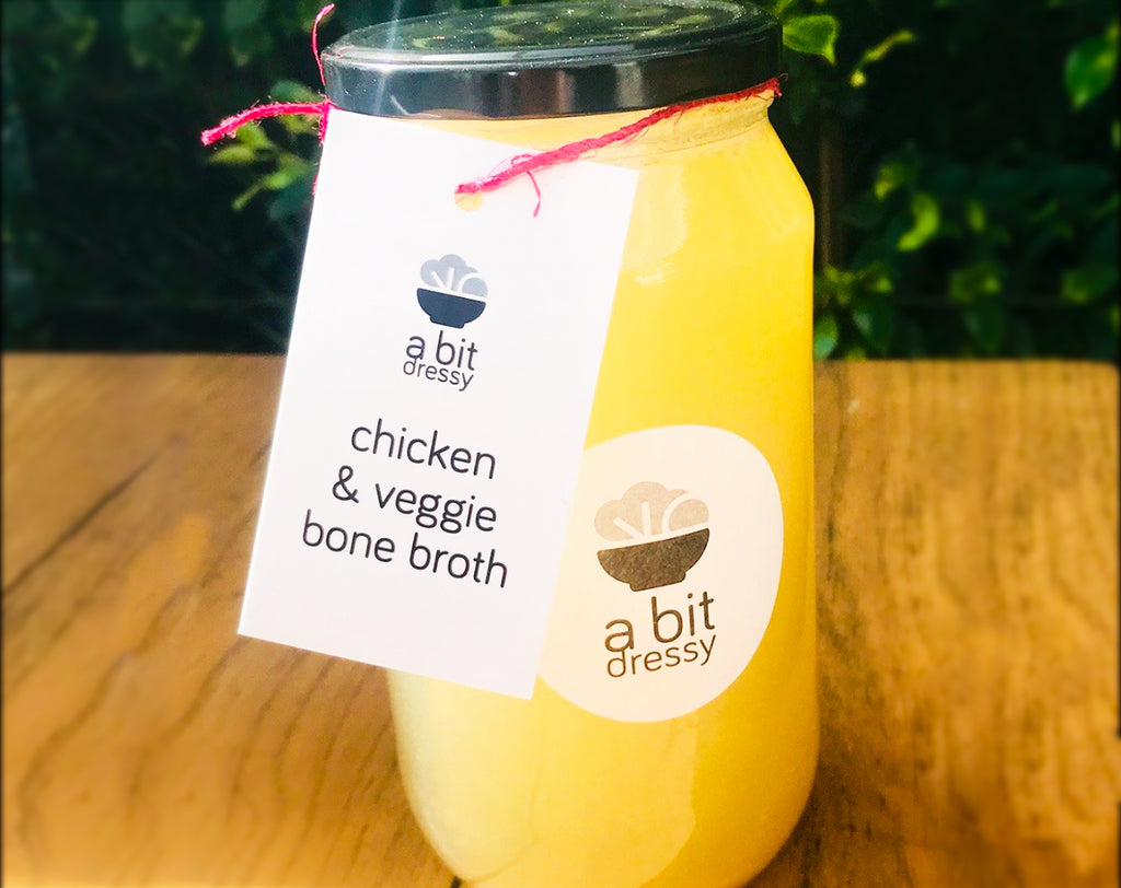  A jar of chicken and vegetable bone broth, featuring a nourishing and flavorful broth made from chicken bones and vegetables.