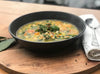A hearty bowl of chicken, vegetable, and barley soup, featuring tender chunks of chicken, a medley of colorful vegetables, and plump barley grains in a flavorful broth