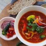 A bowl of taco soup, displaying a flavorful and hearty combination of ingredients, reminiscent of the classic flavors of a taco.