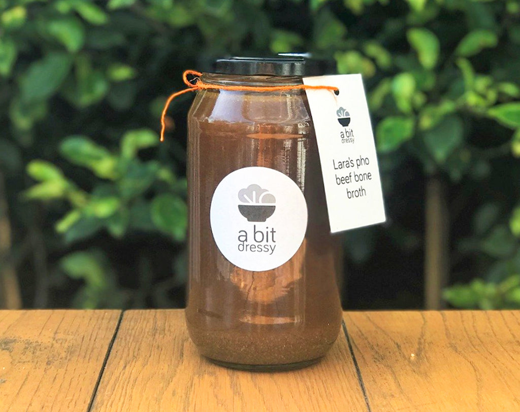 A glass jar of Lara's Beef Bone Broth, featuring a rich and savory broth made from beef bones, perfect for adding depth and flavour to various recipes