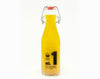 A bottle of Lara's Number 1 Tart Salad Dressing with citrus notes, showcasing a zesty and tangy dressing perfect for enhancing the flavor of your salads