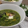 A bowl of Green Goddess soup, showcasing a vibrant green color and a medley of fresh, wholesome ingredients, ready to be enjoyed.