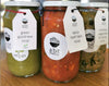 A trio of soups in glass jars, featuring Green Goddess Soup and Chicken and Vegetable with Barley Soup, offering a variety of delicious soup options.