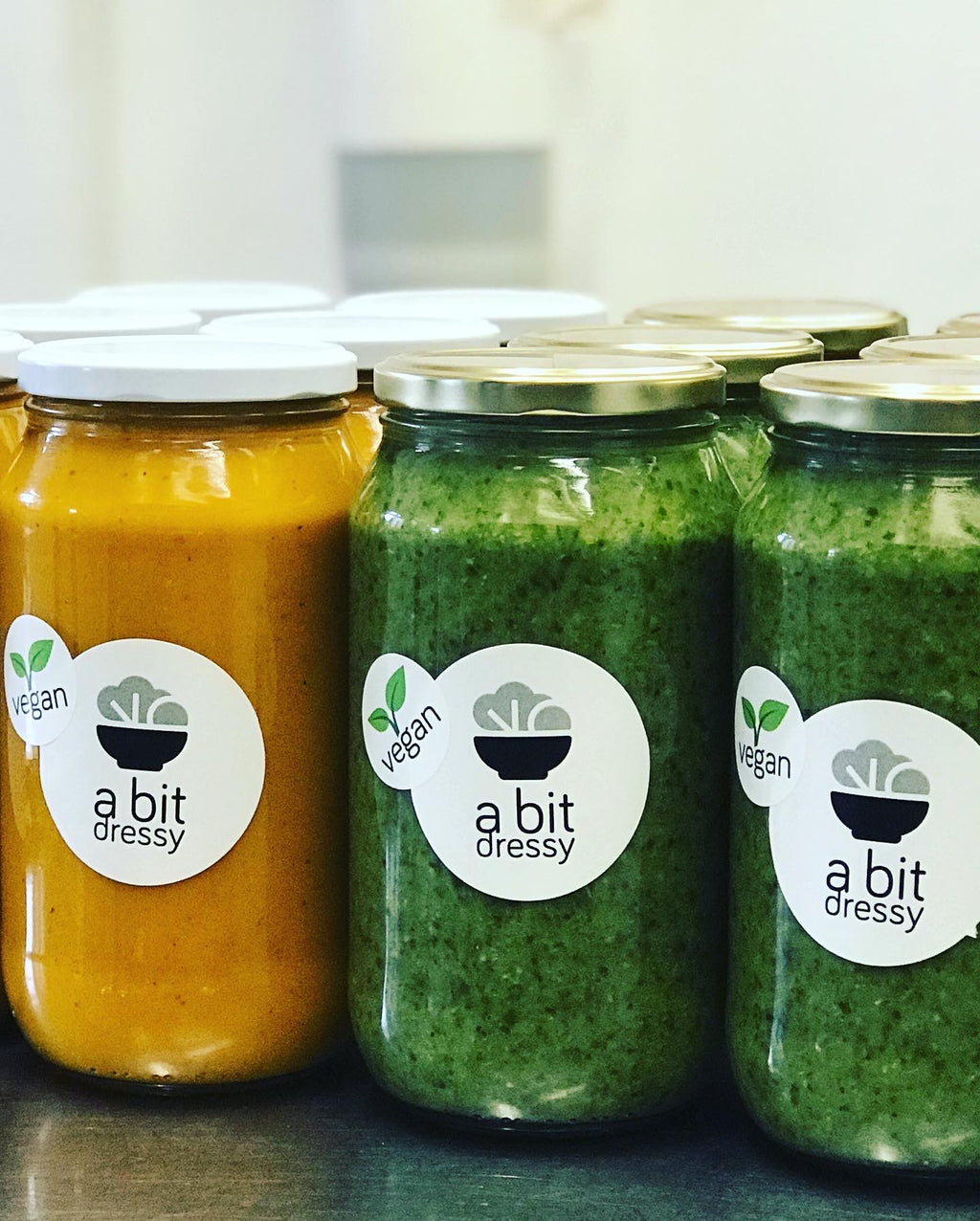 Jars of Green Goddess Soup and Thai Pumpkin Soup, featuring two vibrant and flavorful soup options presented in convenient jar packaging.