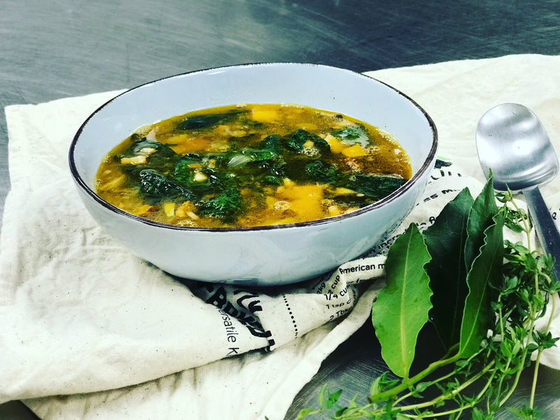 A bowl of French De Puy lentil, bacon, and spinach soup, featuring a rich and savory blend of ingredients, with tender bacon, French lentils, and vibrant spinach