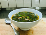 A bowl of French De Puy lentil, bacon, and spinach soup, showcasing a rich and flavorful combination of ingredients, with tender bacon, French lentils, and vibrant spinach