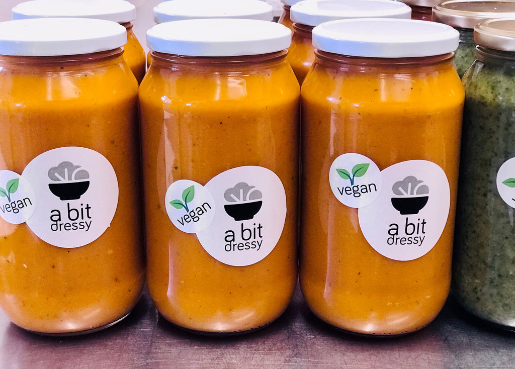 Jars of Thai Pumpkin Soup with coriander, lemongrass, and chili, showcasing a delectable and aromatic soup with a Thai-inspired twist.