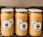 Jars of Tuscan Cannellini Bean Soup with garlic, lemon, and paprika, showcasing a flavorful and aromatic soup.